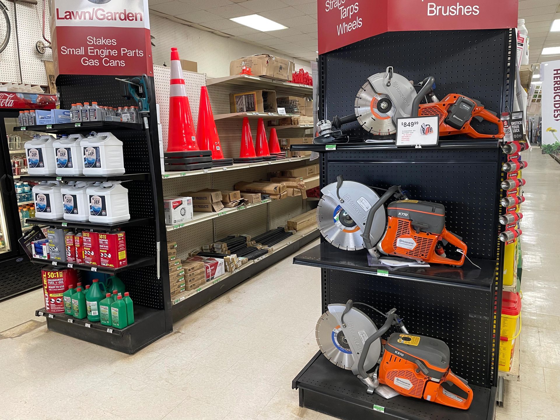 A store aisle filled with lots of tools and brushes.