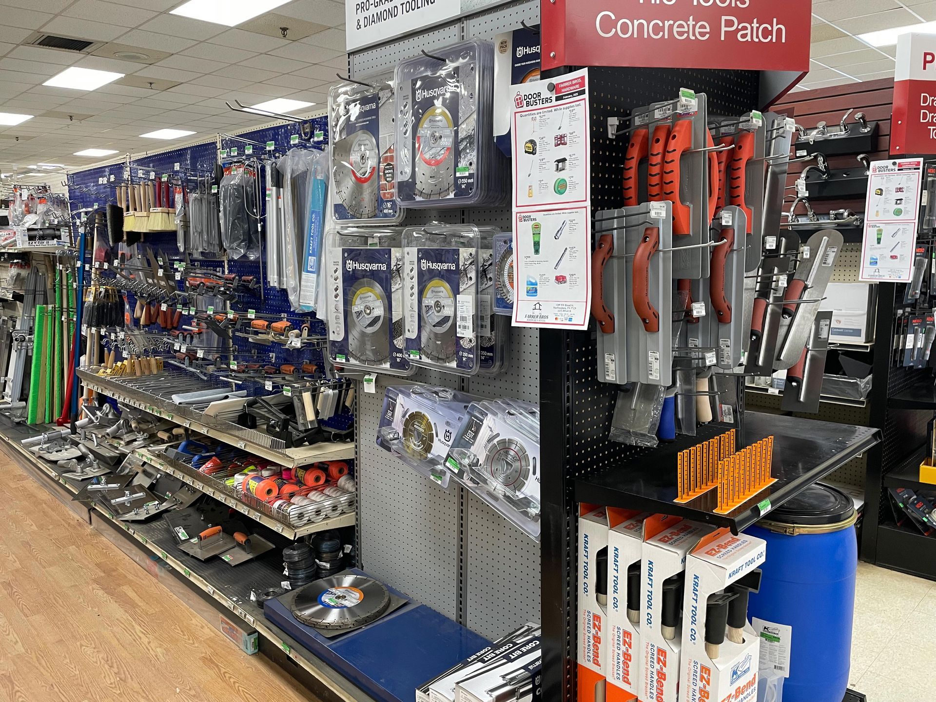 A store aisle with a sign that says concrete patch