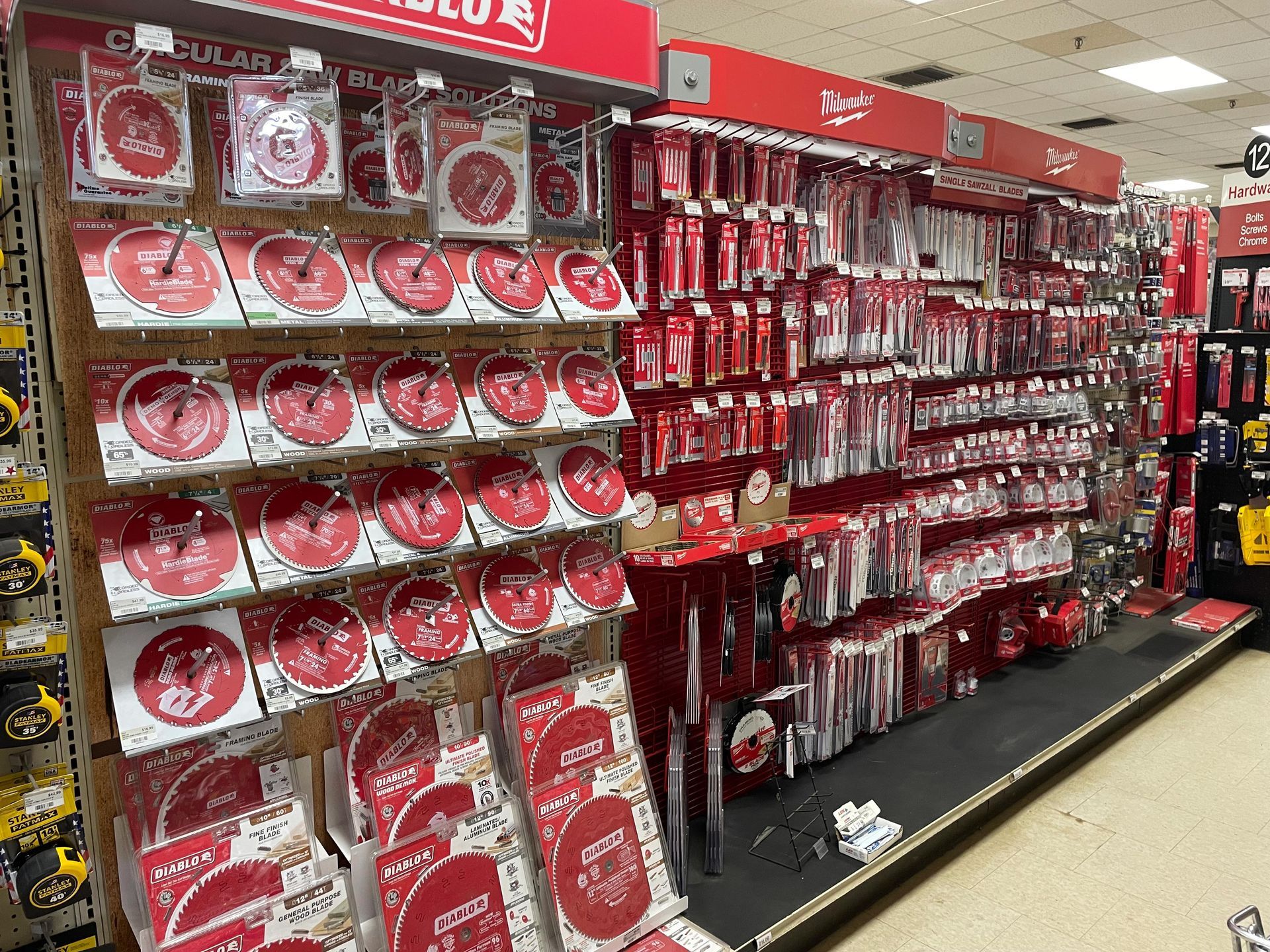 A shelf in a hardware store filled with lots of tools.