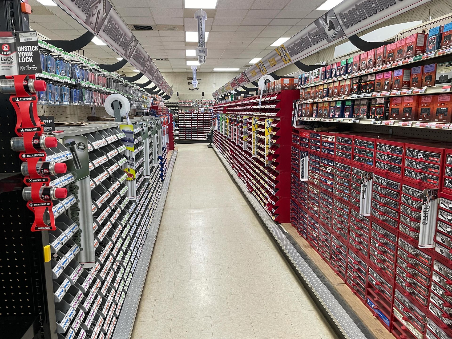 A very long aisle in a hardware store
