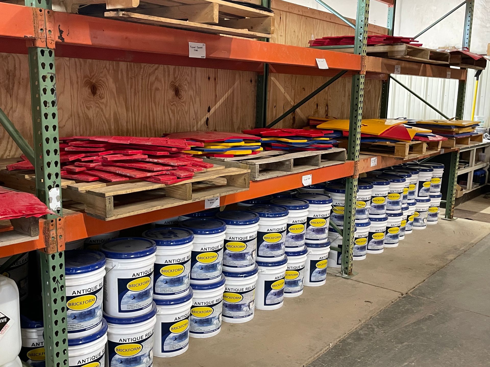 A warehouse filled with lots of buckets and pallets