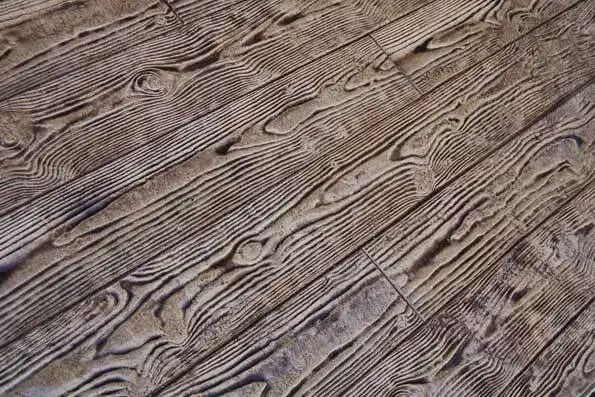 A close up of a wooden floor with a grain pattern.