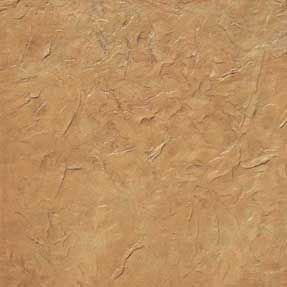 A close up of a piece of brown paper with a rough texture.