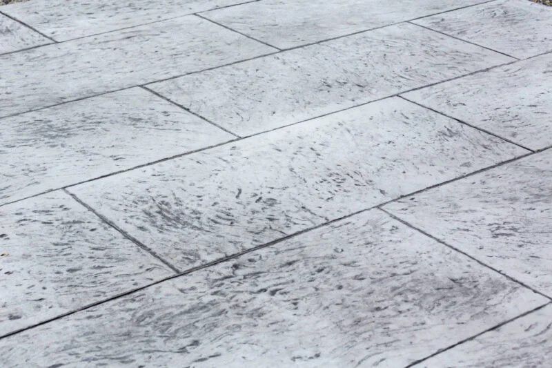 A close up of a gray tile floor