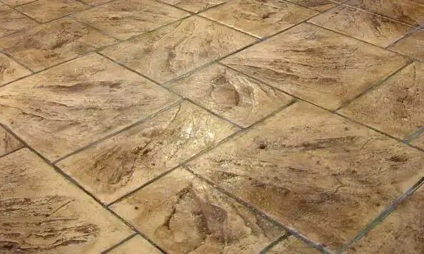 A close up of a tiled floor with a pattern on it.