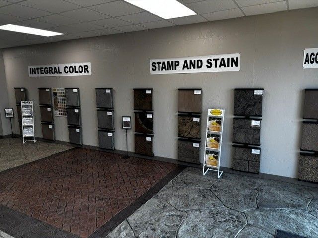 Paint sample display wall with labeled sections for integral color and stamp and stain.