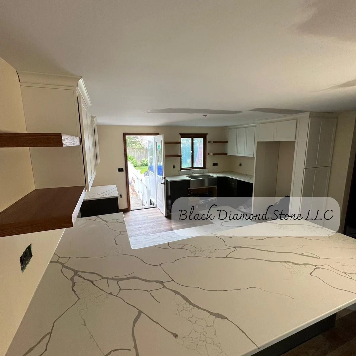 a kitchen with a large countertop and a marble countertop