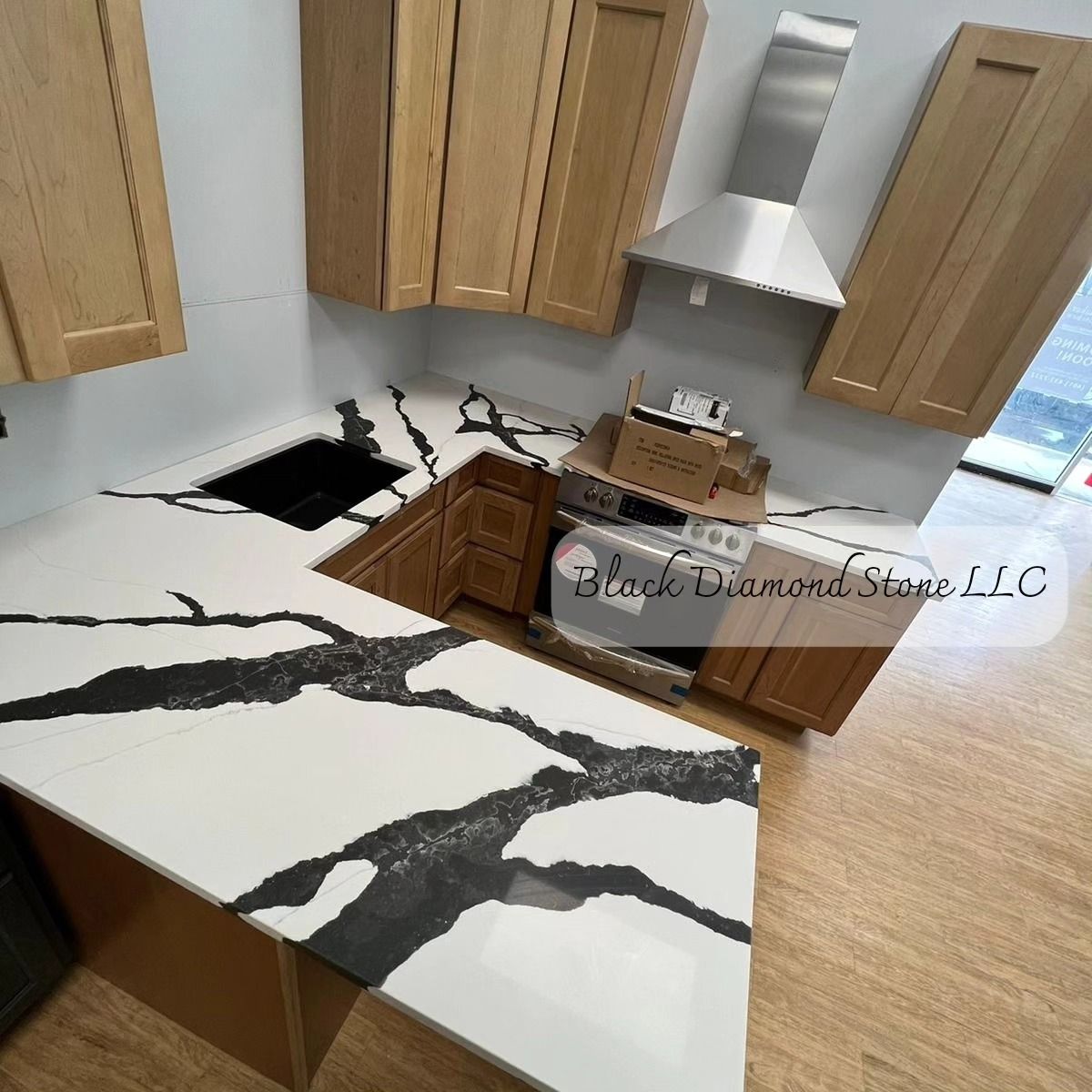 a kitchen with a black and white granite counter top