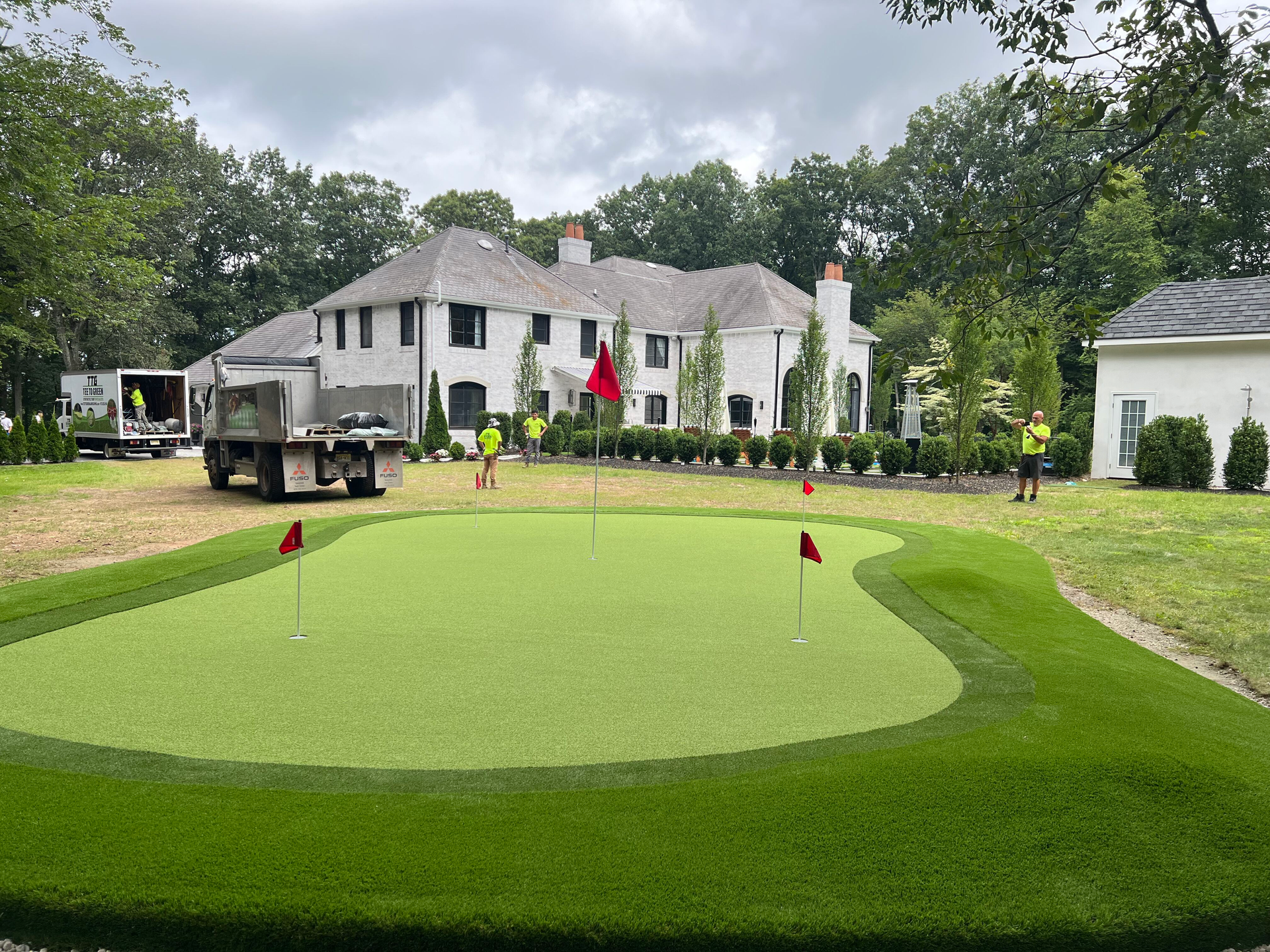 A lawn with an artificial & Synthetic golf putting green in Mendham, NJ 07945