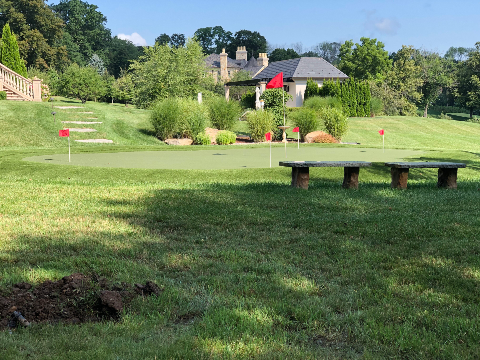 A lawn with an artificial & Synthetic golf putting green in Mendham, NJ 07945