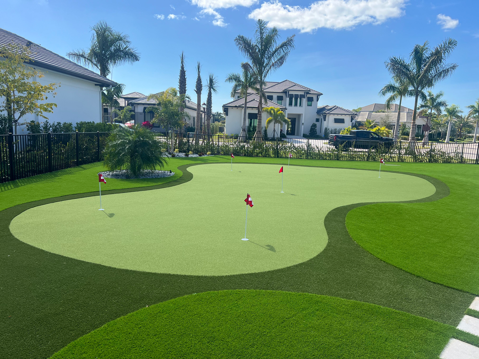 A lawn with an artificial & Synthetic golf putting green in Mendham, NJ 07945