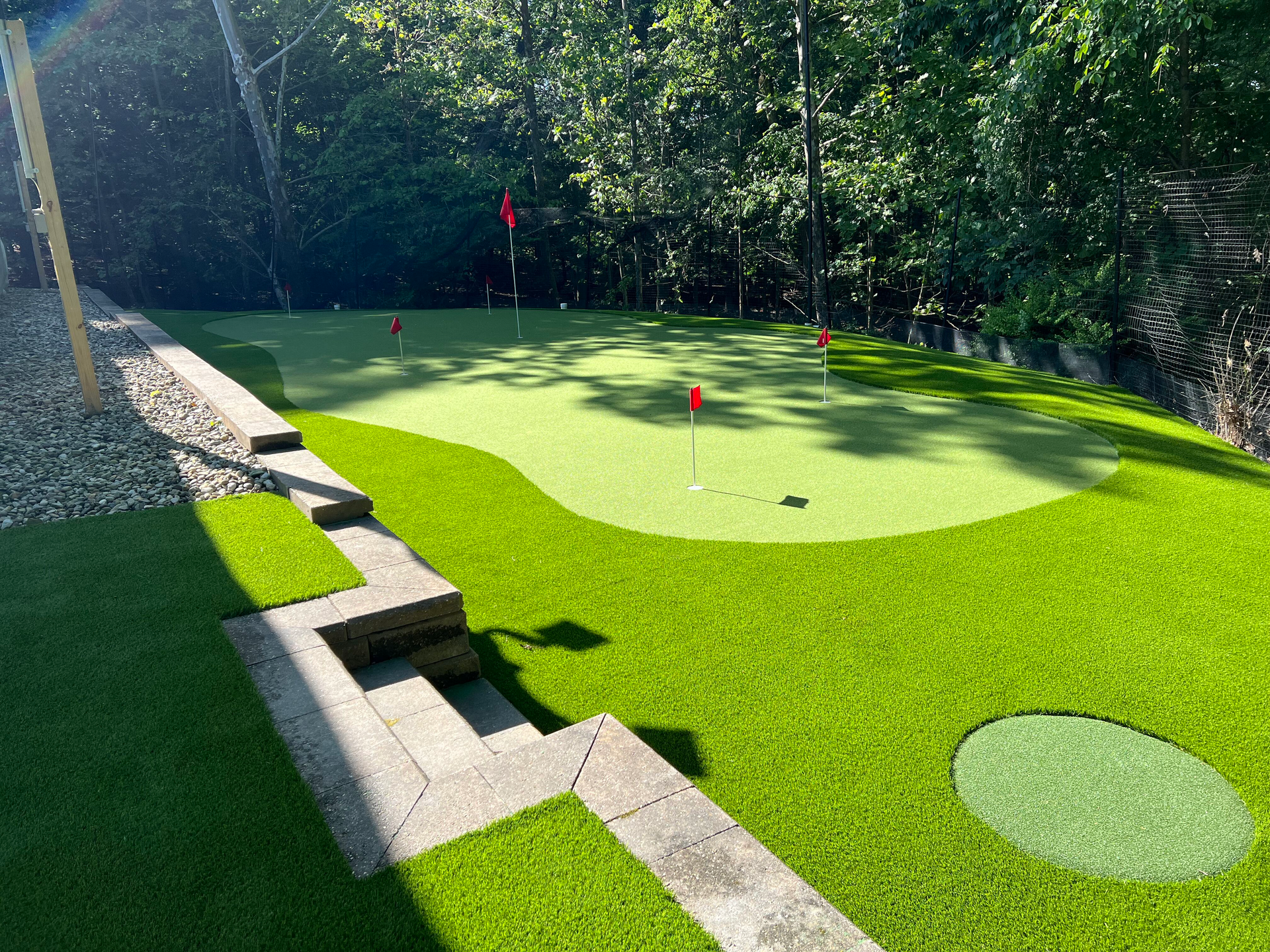 A lawn with an artificial & Synthetic golf putting green in Mendham, NJ 07945