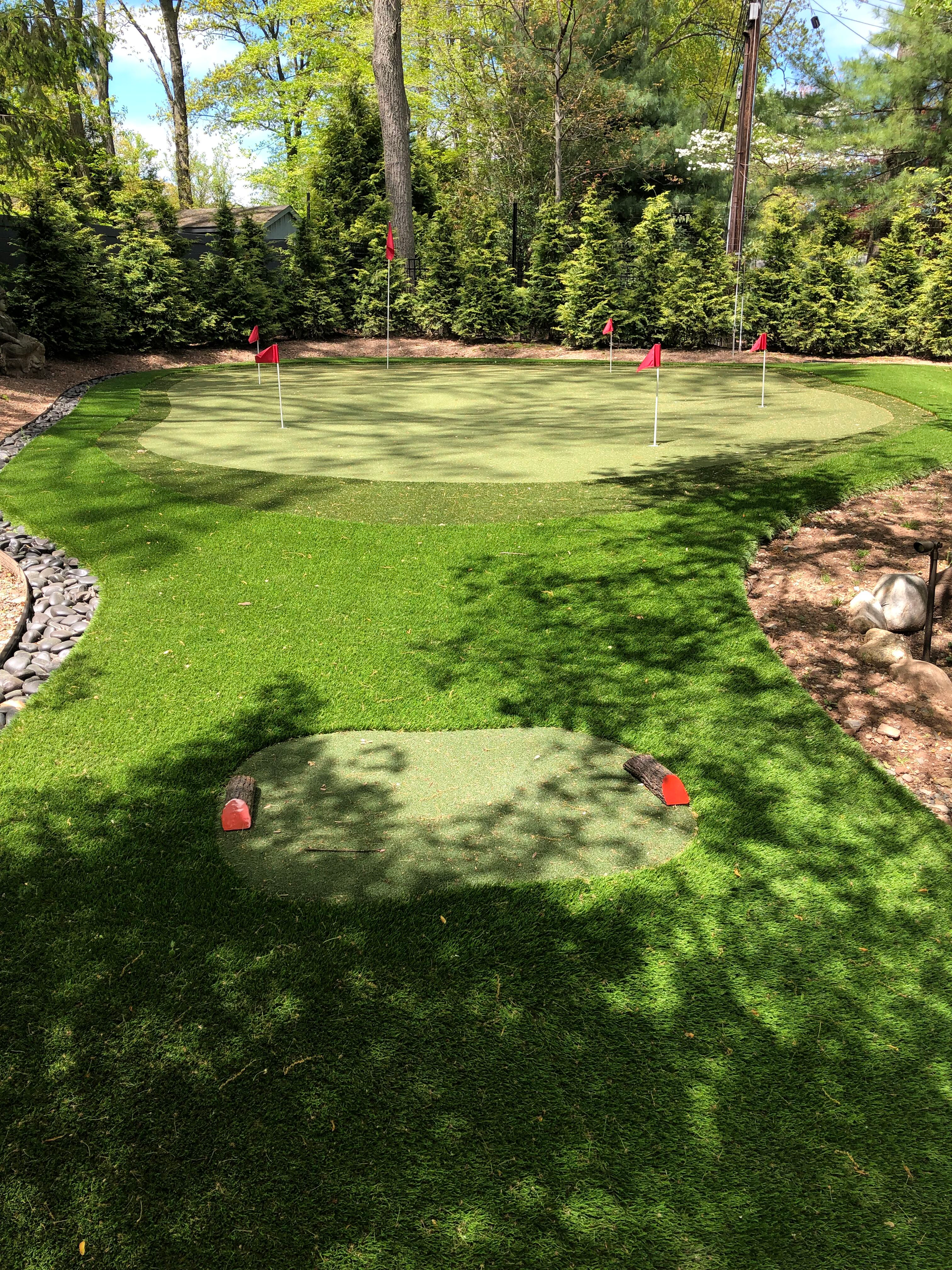 A lawn with an artificial & Synthetic golf putting green in Mendham, NJ 07945