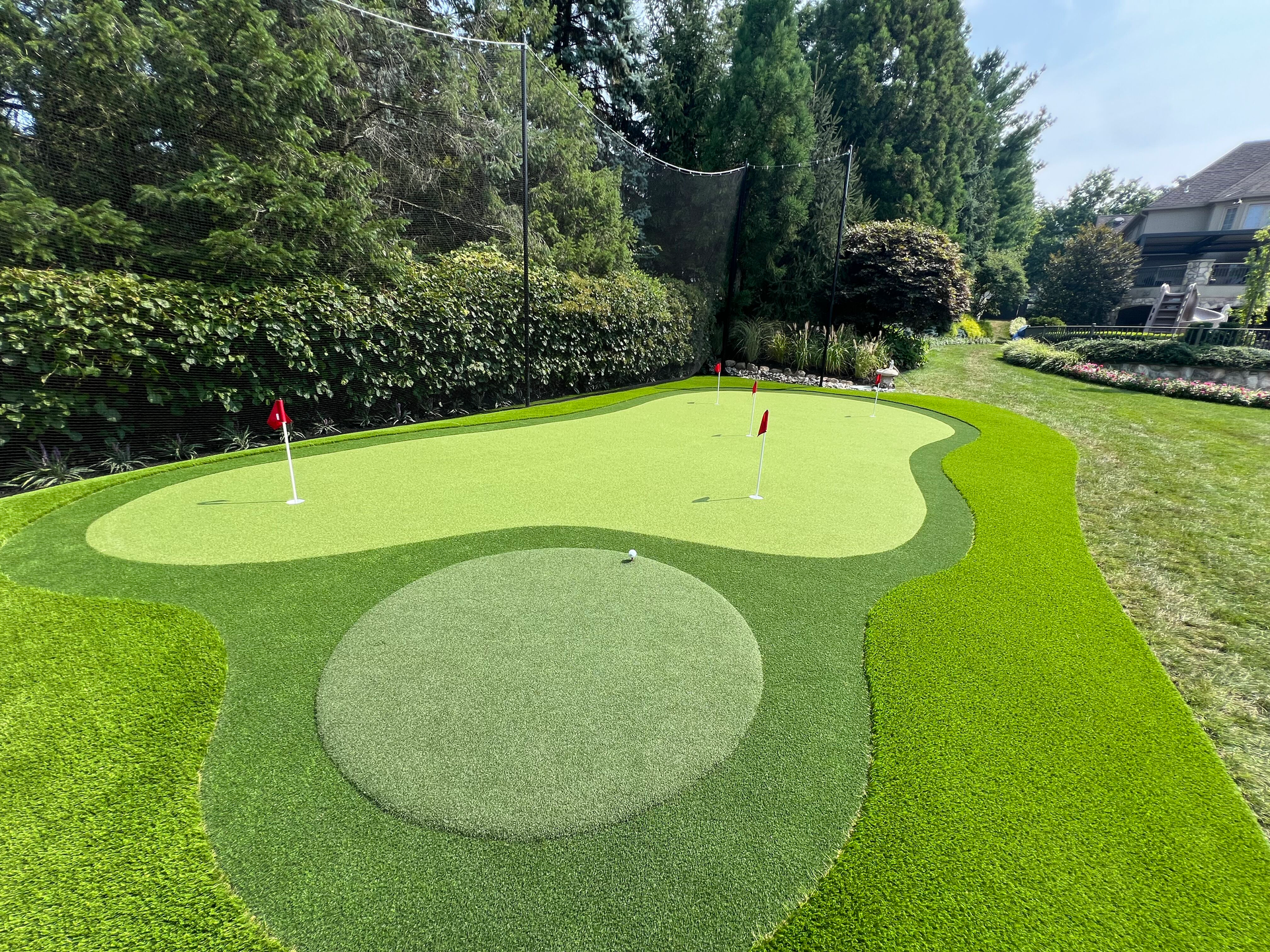 A lawn with an artificial & Synthetic golf putting green in Mendham, NJ 07945