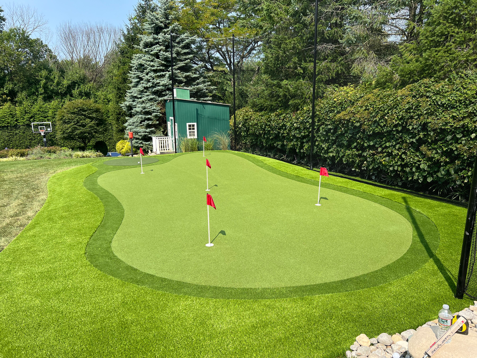 A lawn with an artificial & Synthetic golf putting green in Mendham, NJ 07945