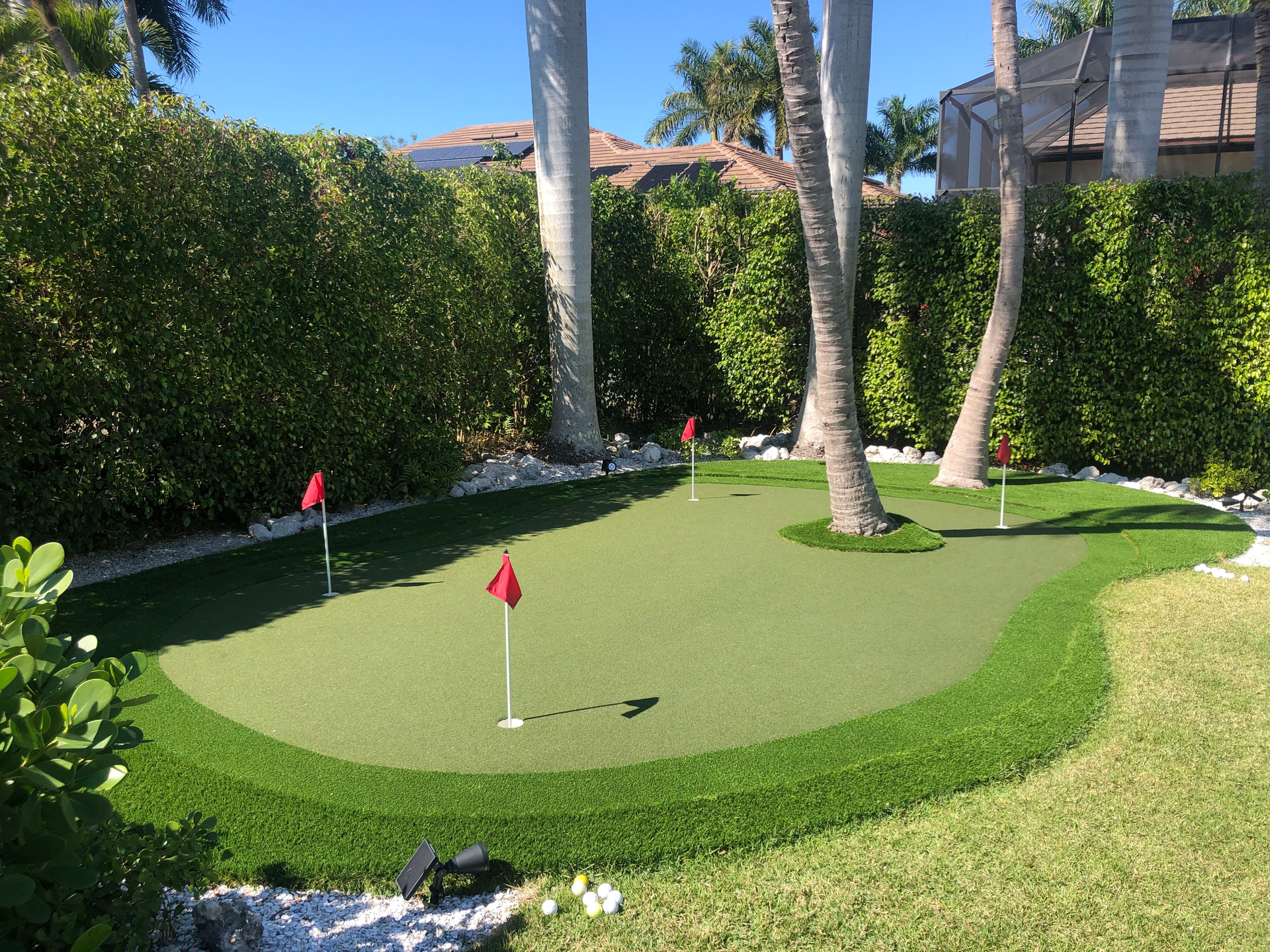 A lawn with an artificial & Synthetic golf putting green in Mendham, NJ 07945