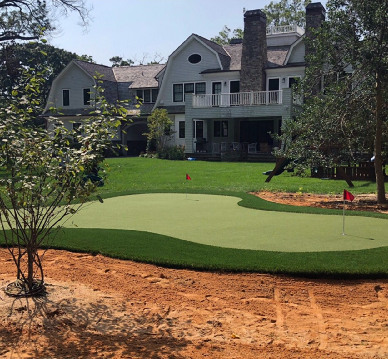 A lawn with an artificial & Synthetic golf putting green in Mendham, NJ 07945
