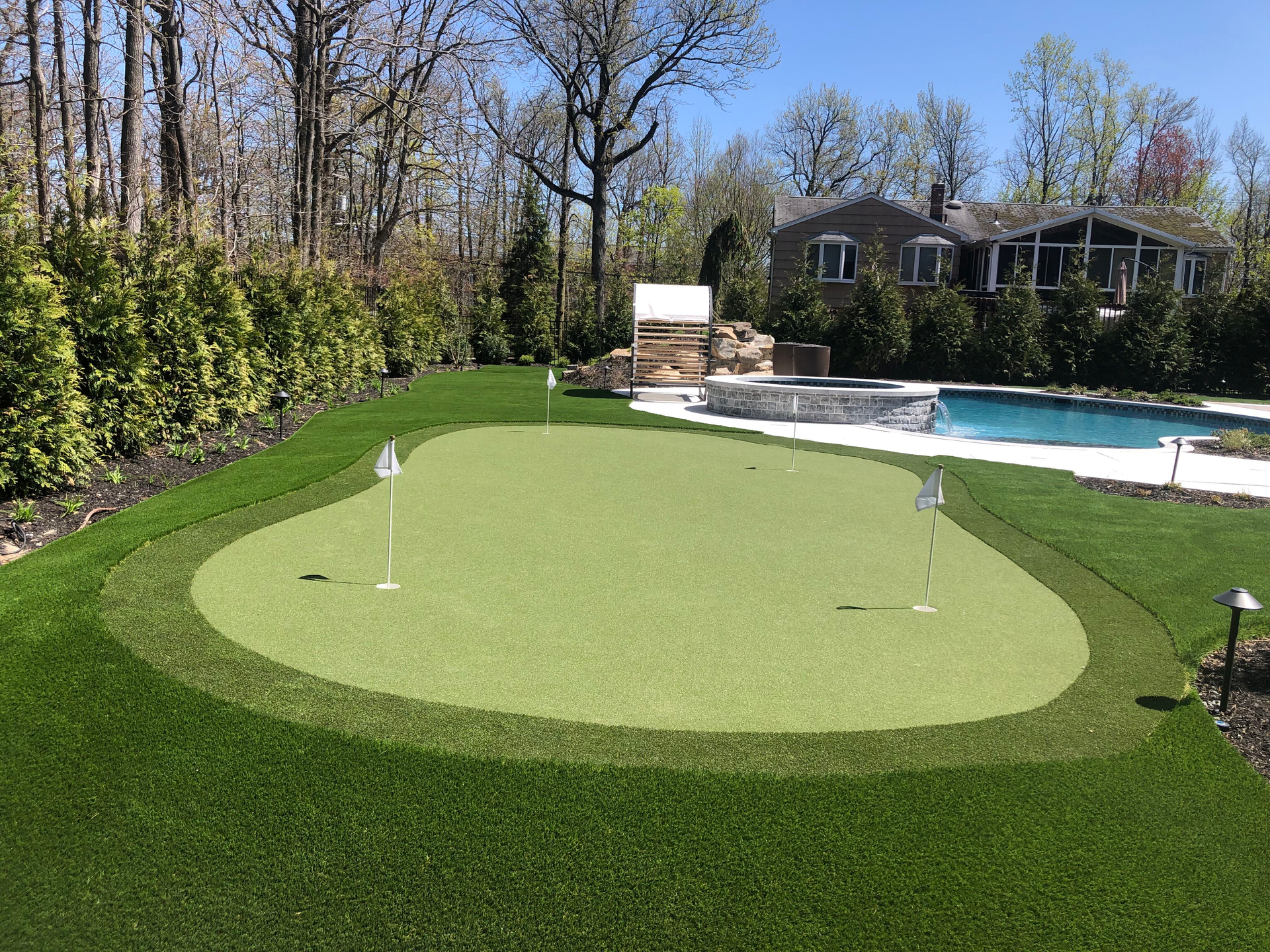 A lawn with an artificial & Synthetic golf putting green in Mendham, NJ 07945