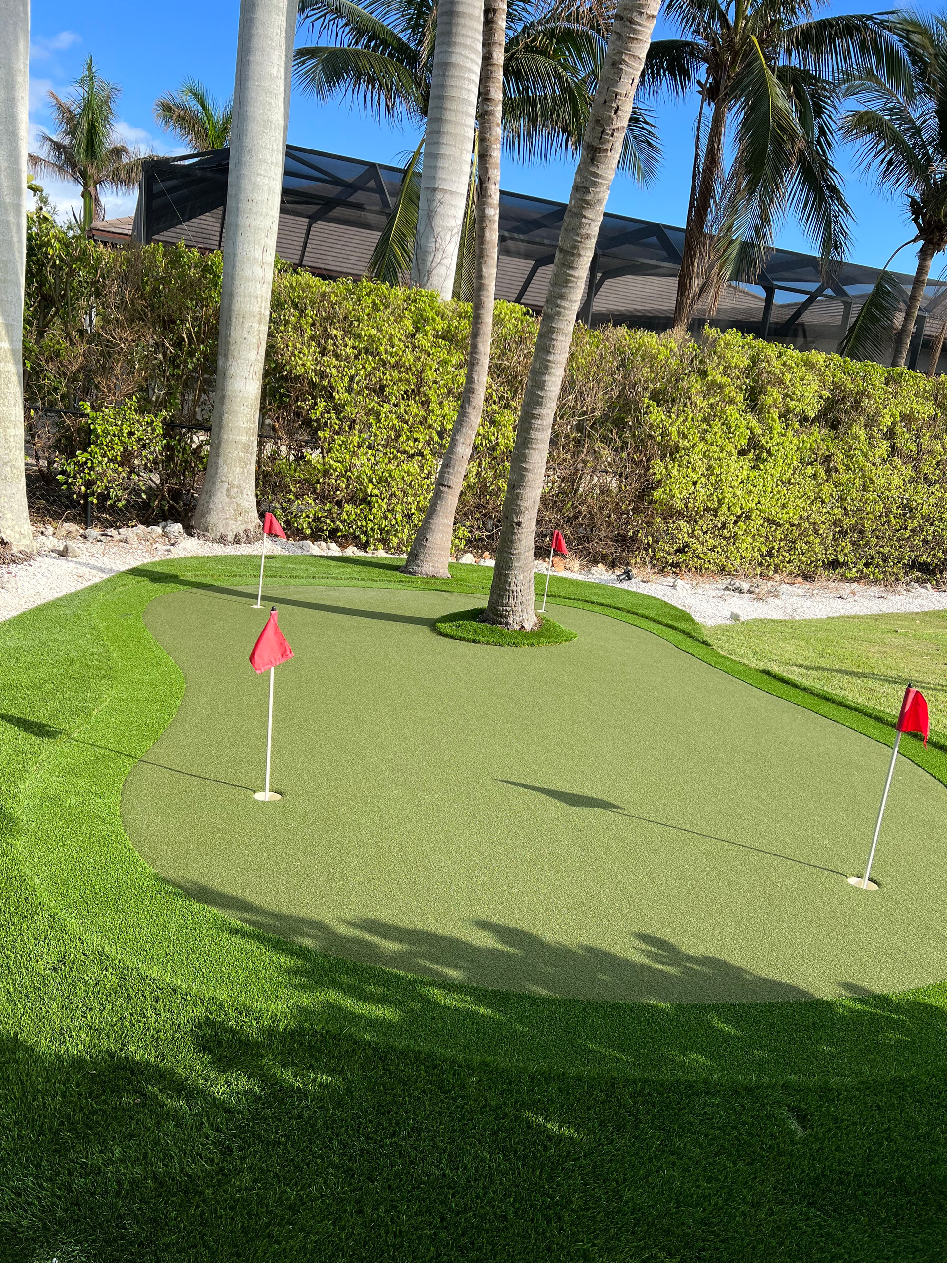 A lawn with an artificial & Synthetic golf putting green in Mendham, NJ