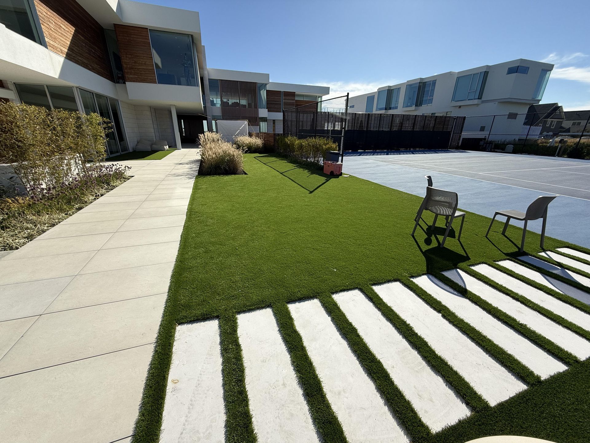 A large house with a lawn in front of it.