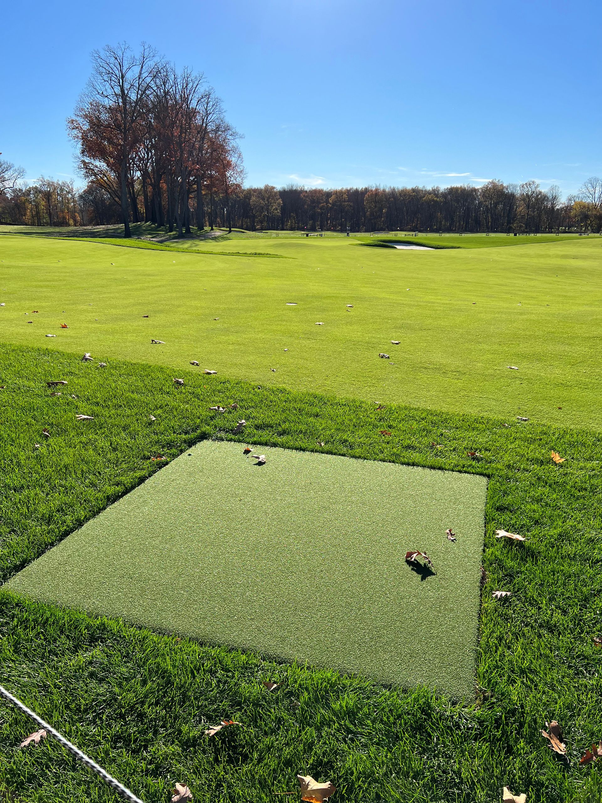 A golf course with a hole in the middle of it.