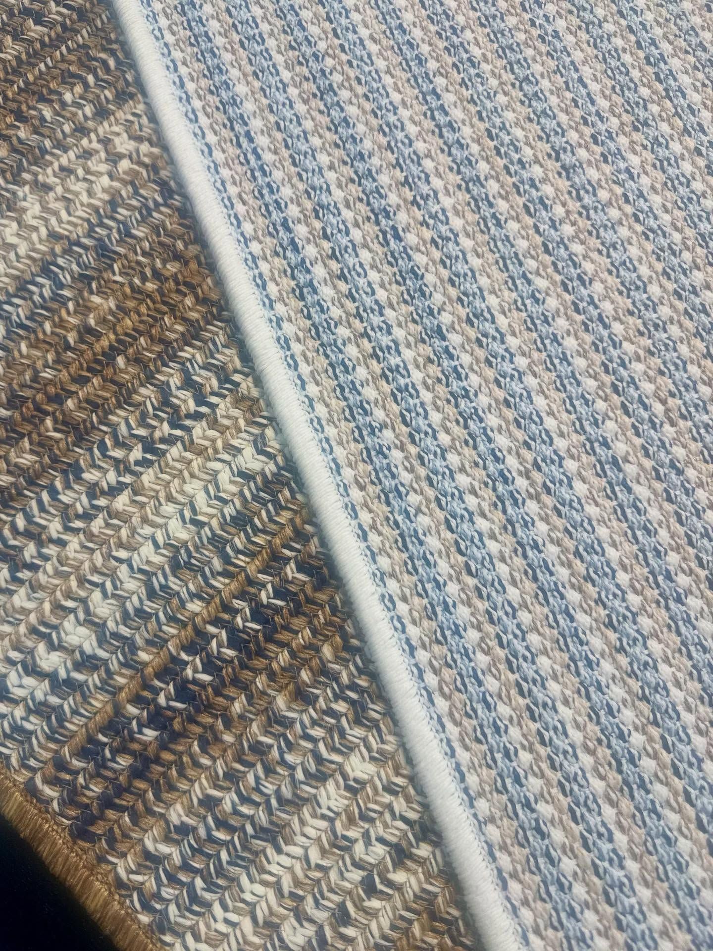 Two woven rugs, one brown and one blue and beige, side by side.