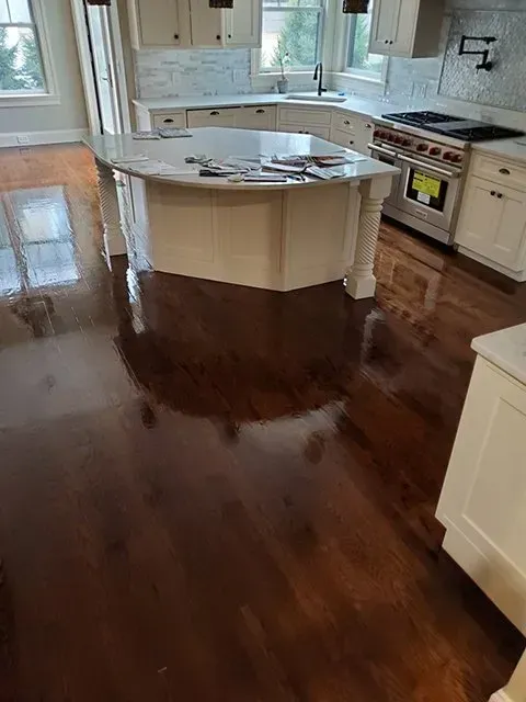 A kitchen with hardwood floors.