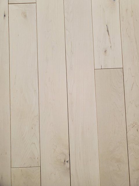 A close up of a white wooden floor.
