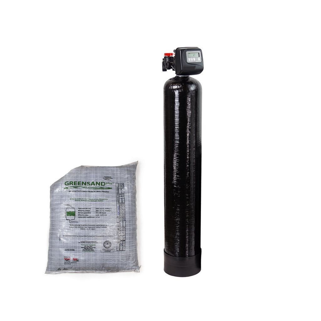 Black water softener tank with control head next to a gray bag of salt pellets