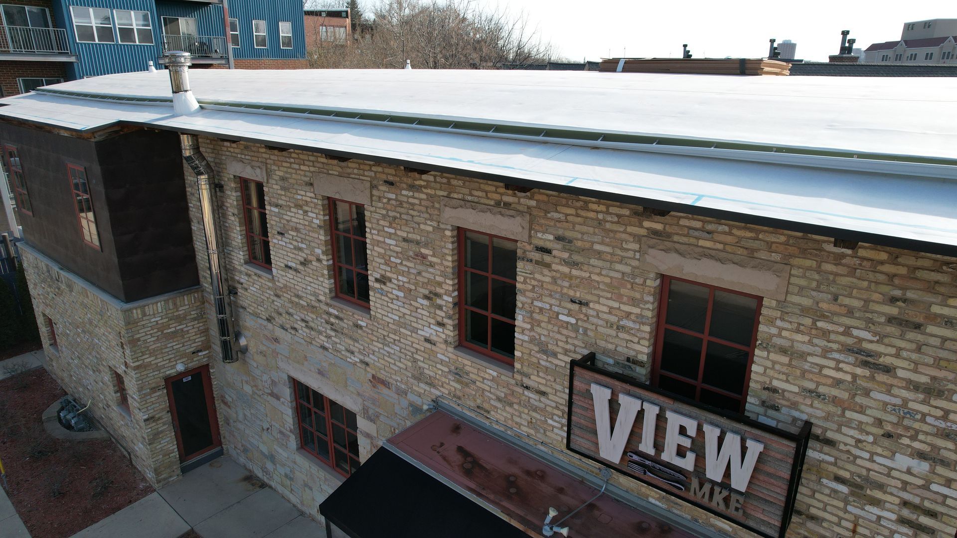 An aerial view of a building with a view sign on the side.
