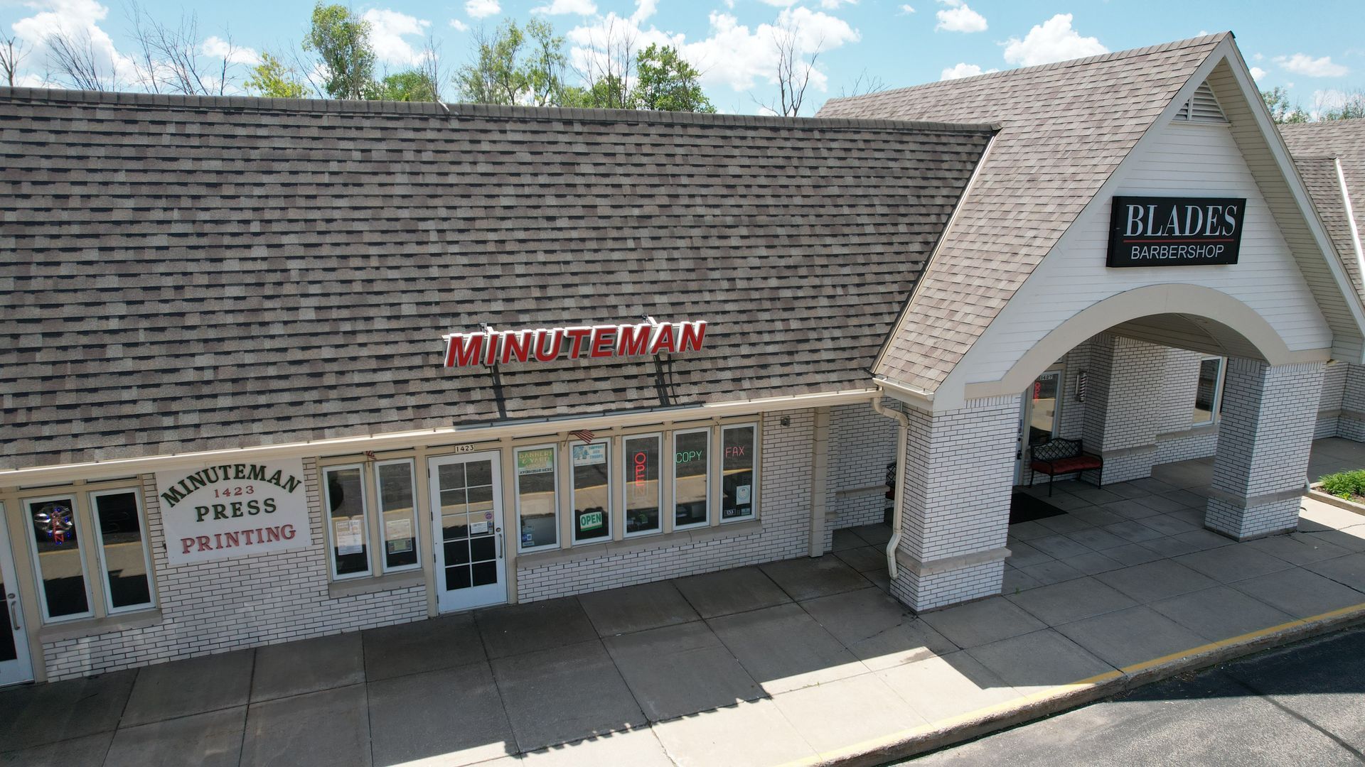 An aerial view of a brick building with a sign that says 'main' on it.