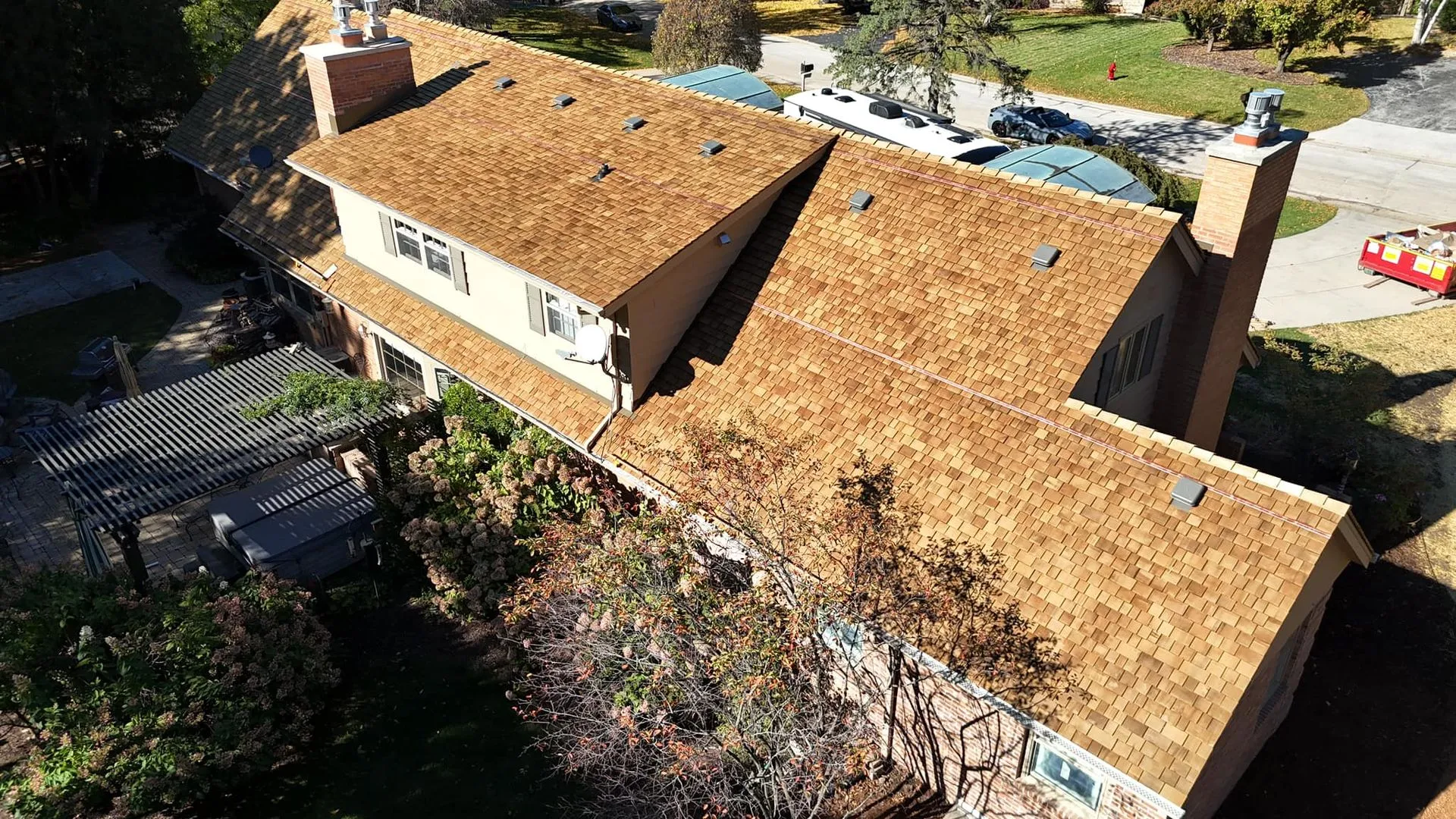 An aerial view of a house with a brown roof.