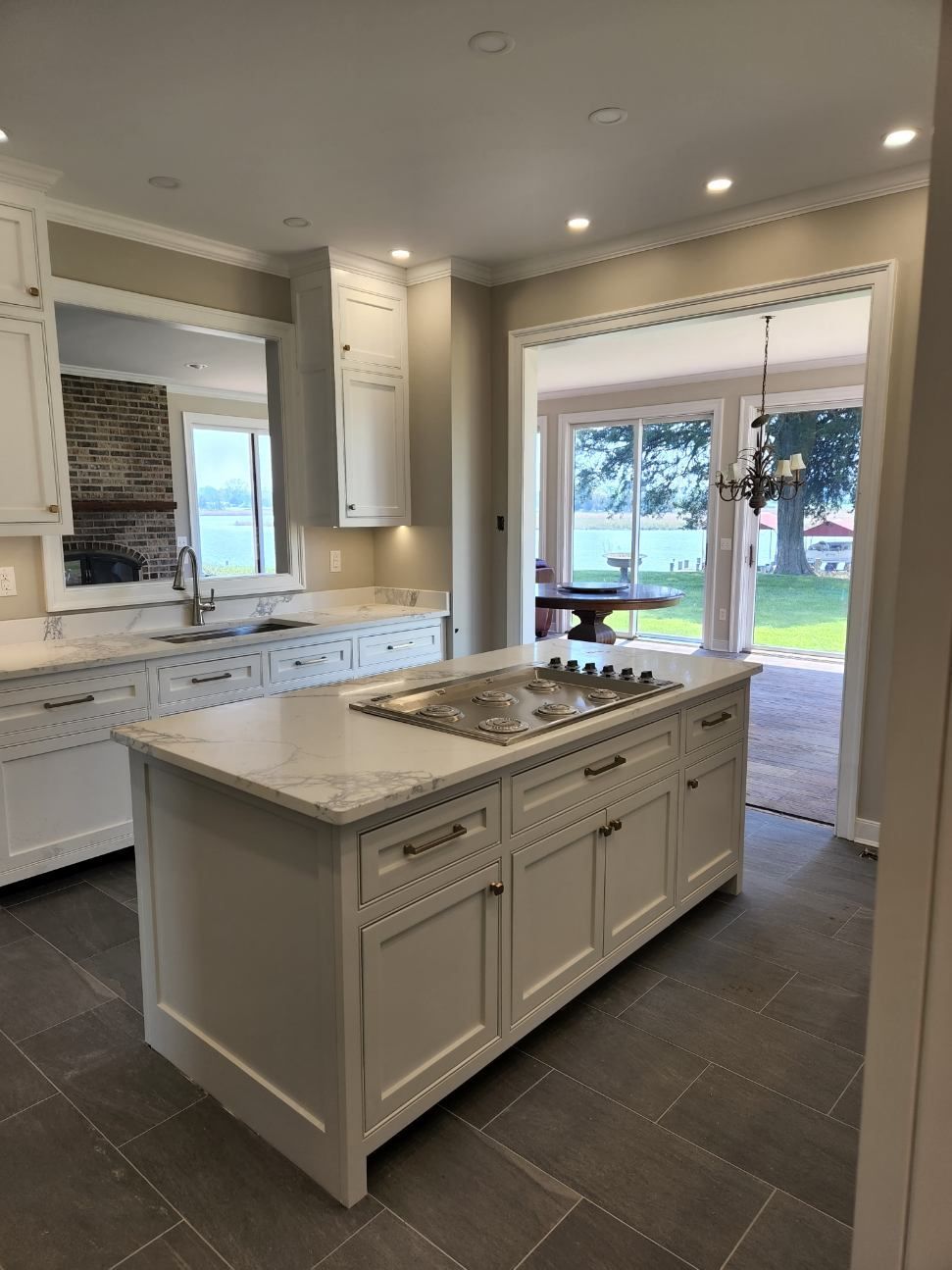 A kitchen with a large island in the middle of it.