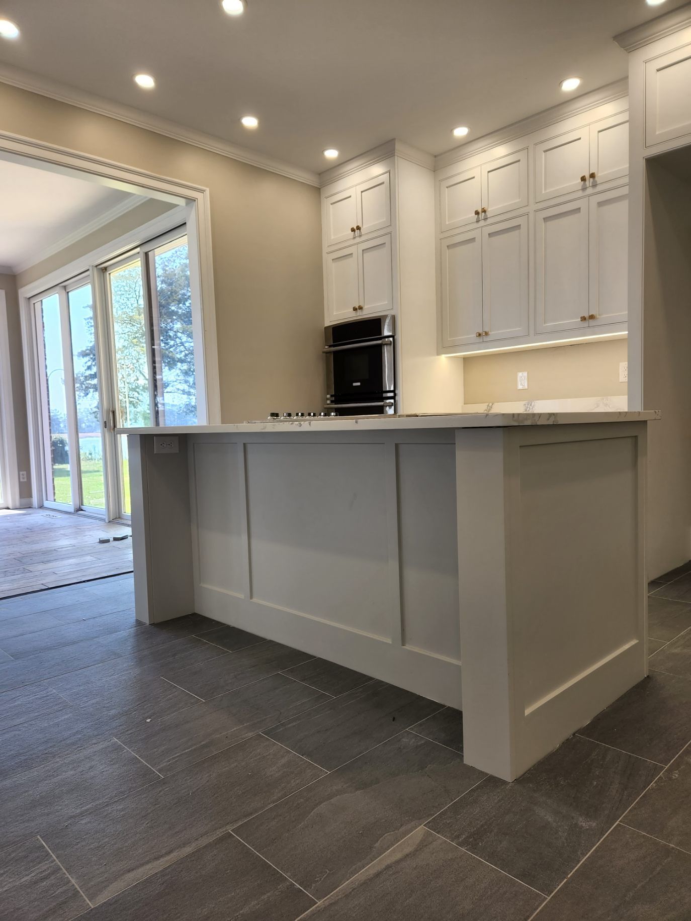 There is a large island in the middle of the kitchen.