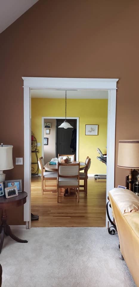 A living room with a doorway leading to a dining room.