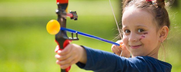 a kid holding her bow