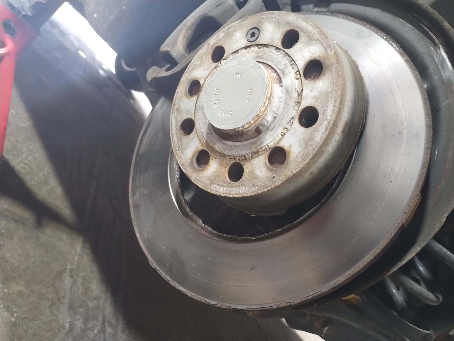 A close up of a brake disc on a car.