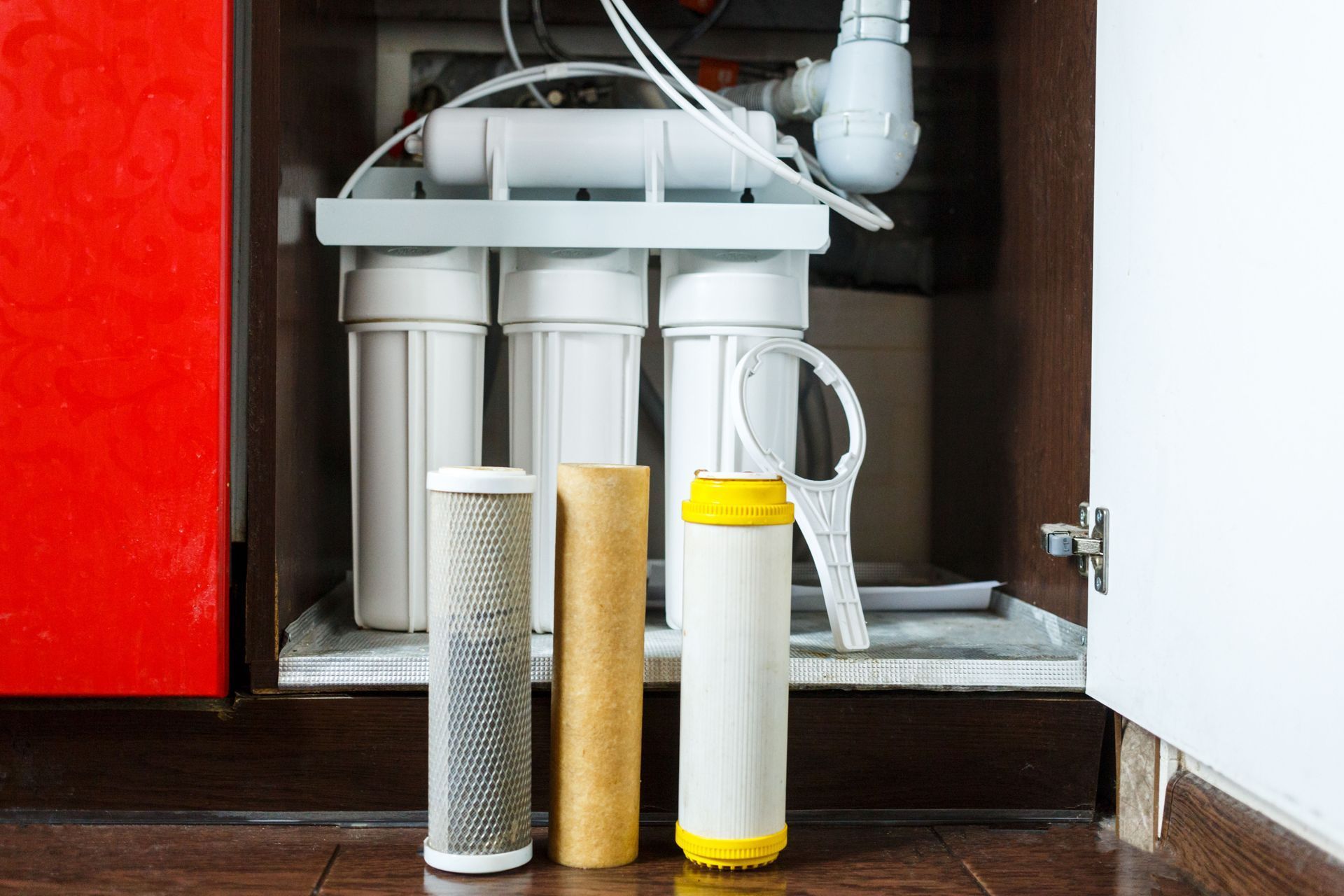 Water filter system under a sink, with replacement filters.