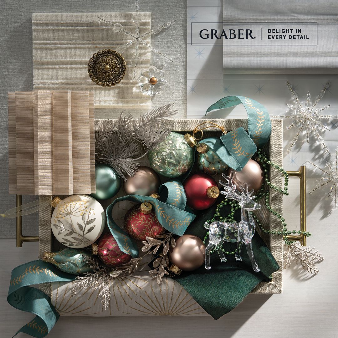 A box filled with christmas decorations and a graber sign