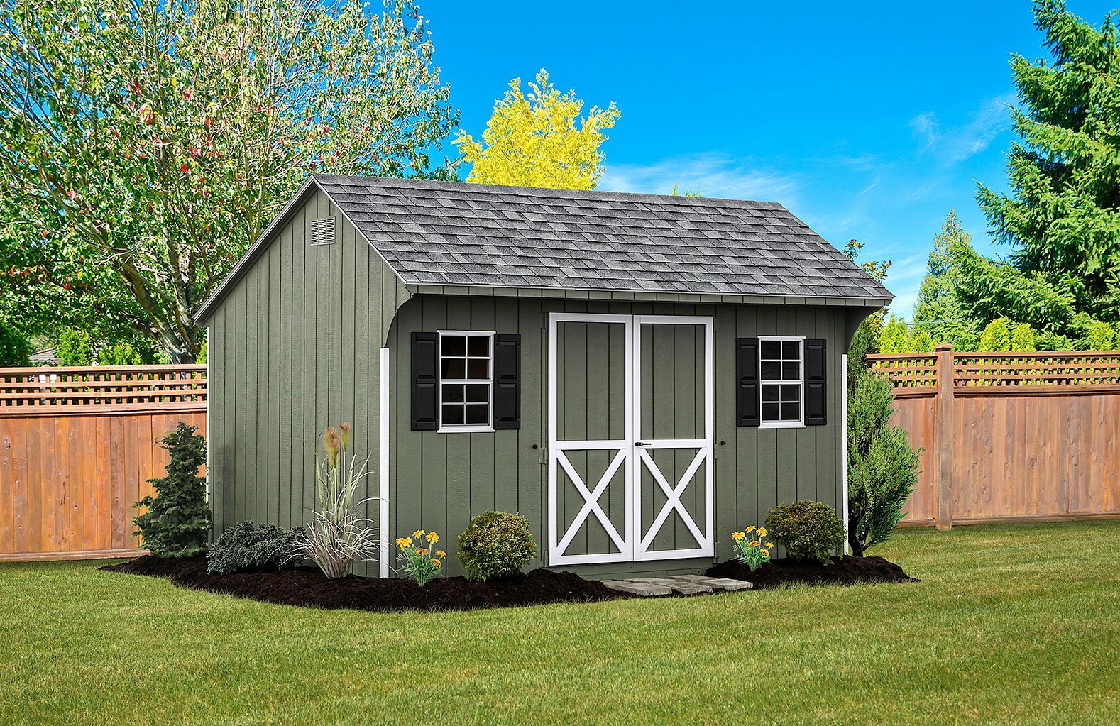 A small shed with a screened in door is sitting in the middle of a lush green yard.