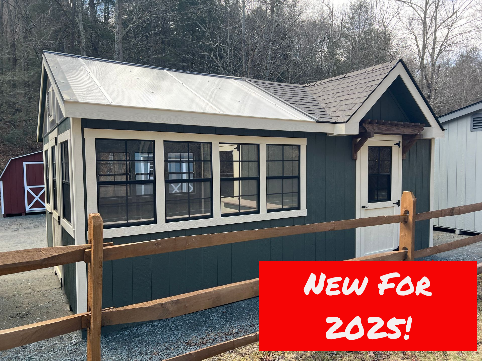 A small house with a fence around it and a sign that says new model