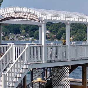 White pergola on deck