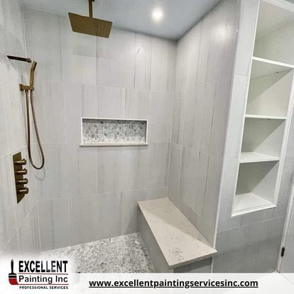 A bathroom with a shower and a bench.