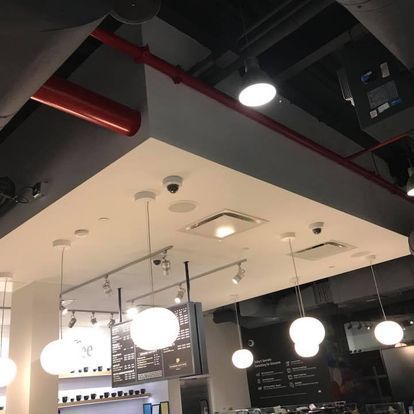 A restaurant with a ceiling that has a sign that says beer on it