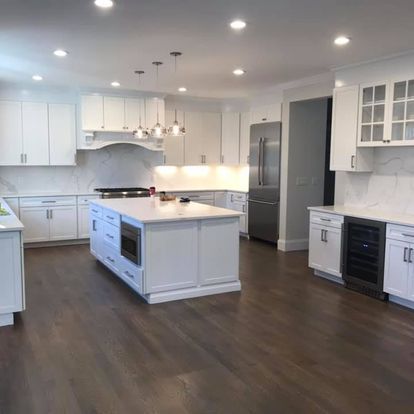 There is a large island in the middle of the kitchen.