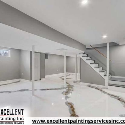 A basement with stairs and a marble floor.