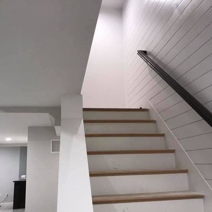 A set of stairs leading up to the second floor of a house.