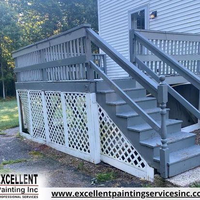 The stairs are painted gray and the deck is painted white.
