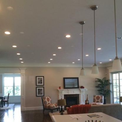A living room with a fireplace and a table