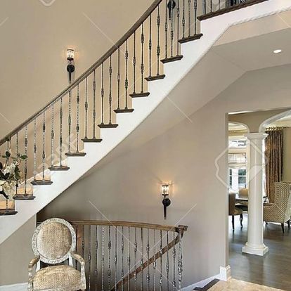 A staircase in a house with a chair in front of it